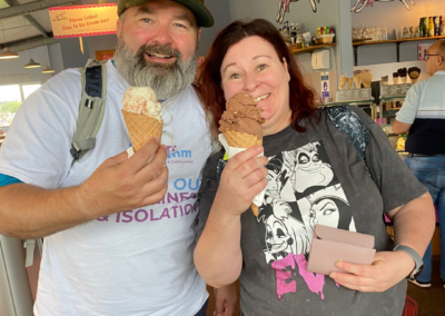 A man and a woman (Greg and Diane) pose with their ice creams!