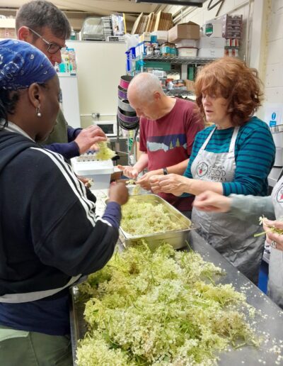 Craigmillar Community Grows: A group of people are standing in a kitchen.