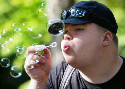 Young man blowing bubbles