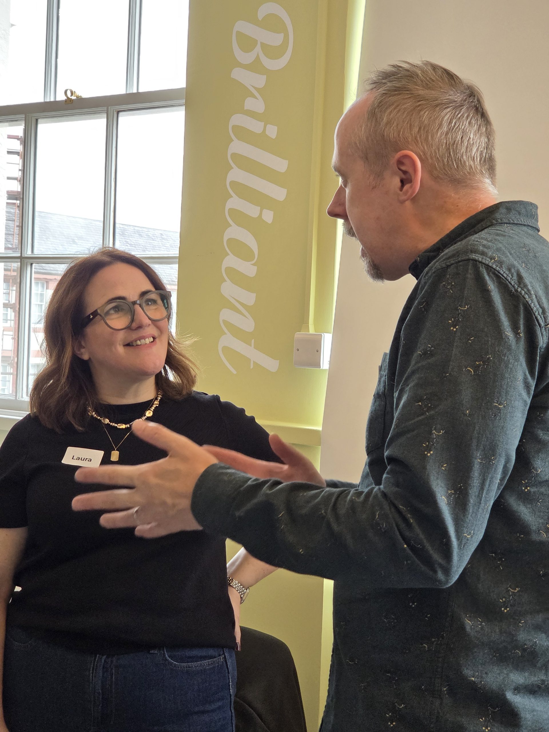 Carr Gomm Board Development Day Man with grey hair speaking to woman with glasses