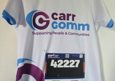 A picture of a Carr Gomm jersey with a marathon sticker fixed to the front.